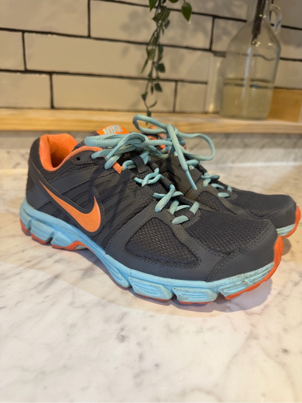 Nike Dark Gray Running Shoes with Coral & Light Blue Accents